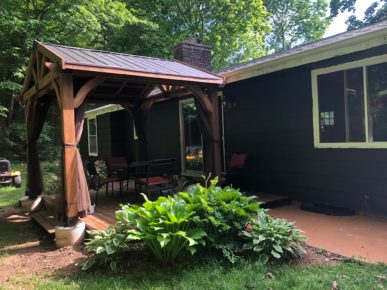 Gazebo with mosquito netting on existing deck.