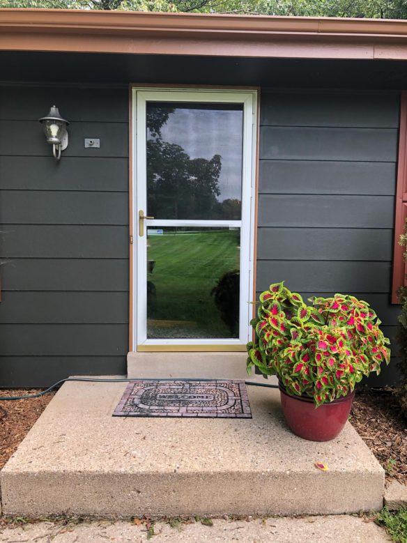 BEFORE: White storm door with loud closure and color that didn't match the rest of the house